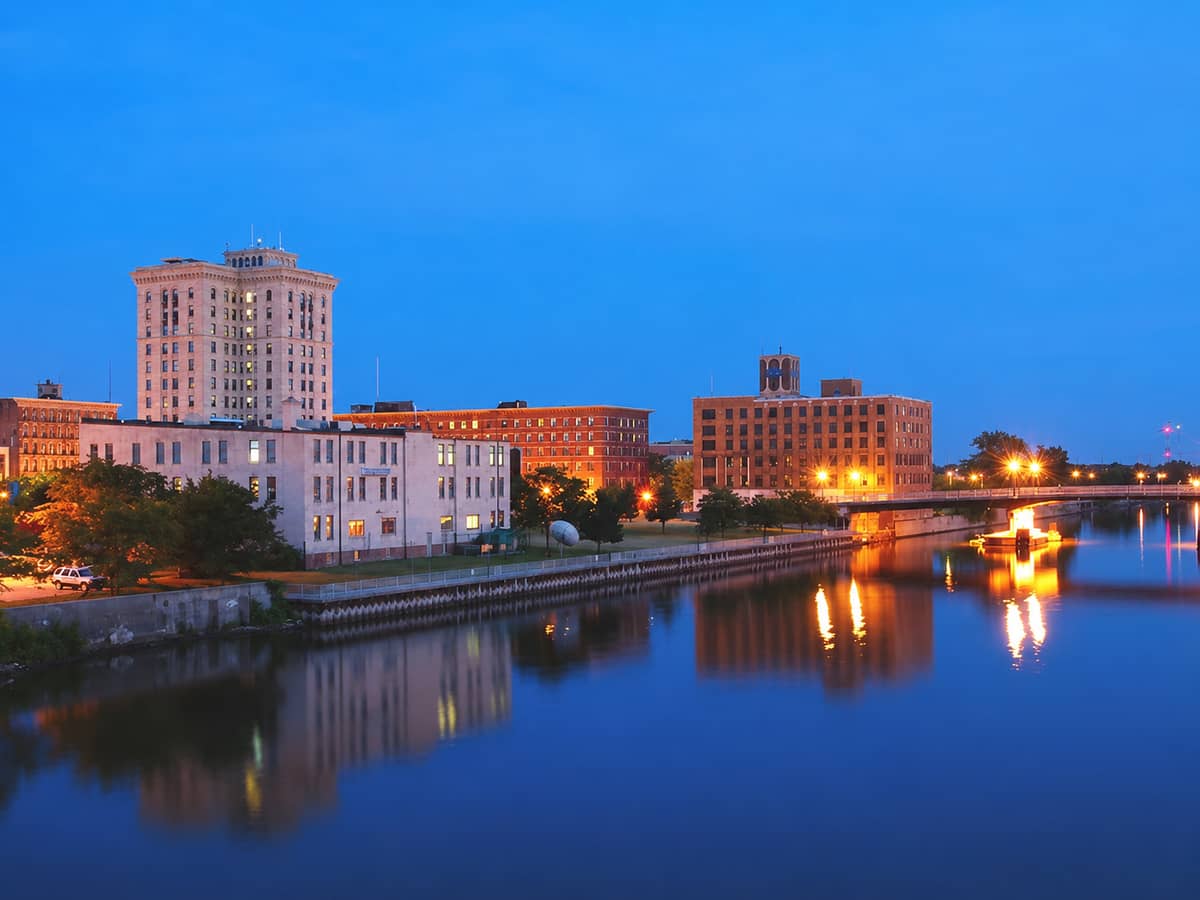 The downtown Saginaw, Michigan riverfront along the Saginaw River at dusk
